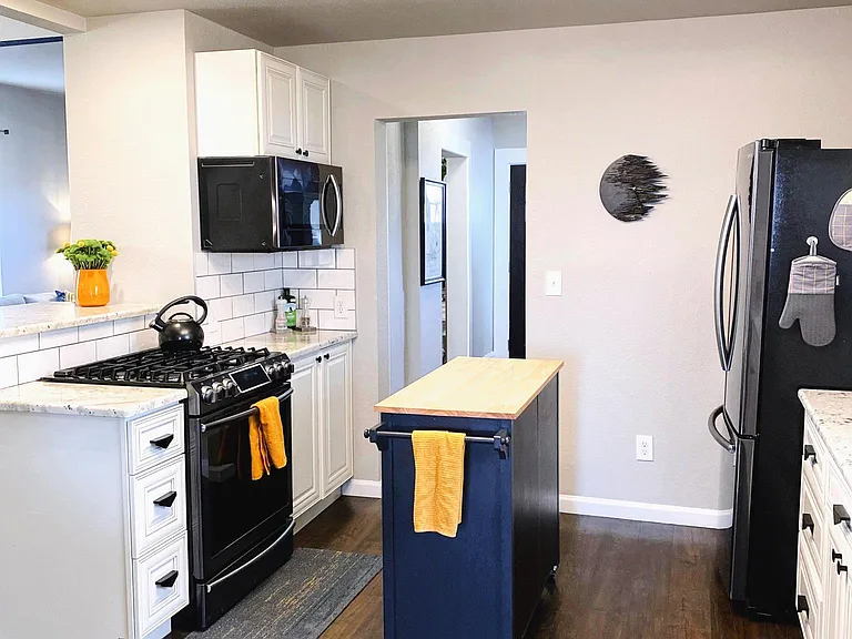 Gourmet kitchen with island and gas stove