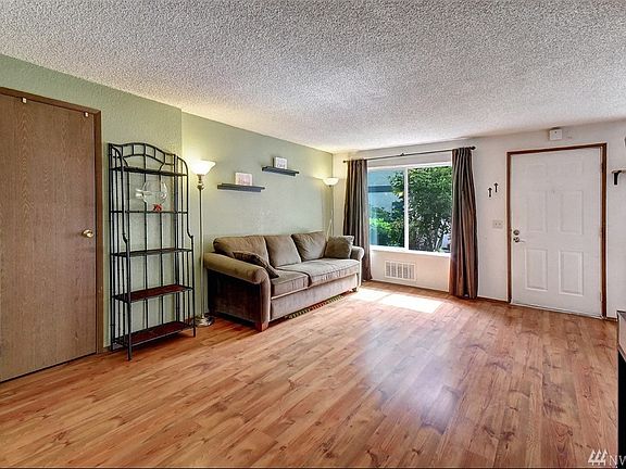 Spacious living room with great storage closet.