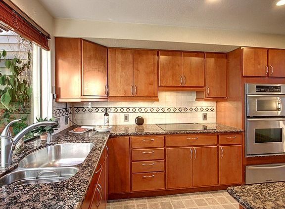 Extensively updated Kitchen, complete with new cabinets, granite