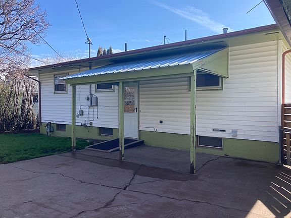 Back of house with covered patio