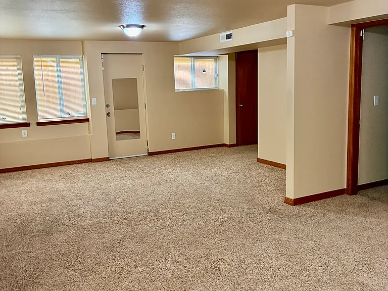 Bottom floor living area with access to side yard.