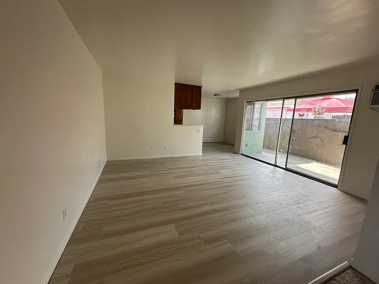 Living room, dining room area with patio slider