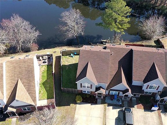 Well Maintained and updated End Unit Townhome is situated on a large private lot with direct access to a neighborhood lake.