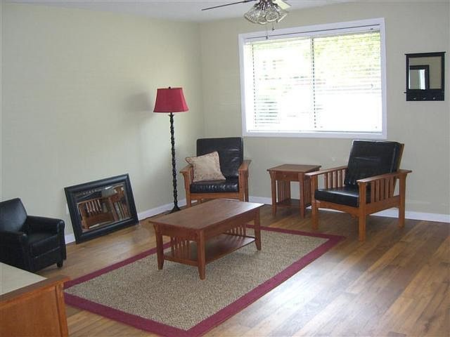 Spacious living room with big window.