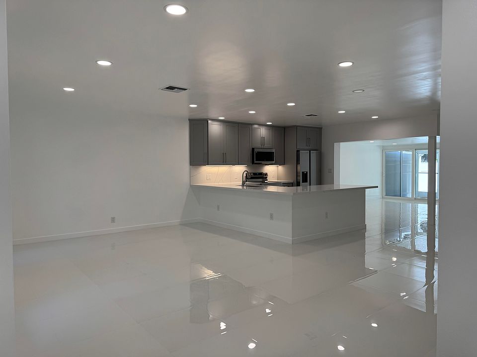 Entrance, living area, open floor plan with new, huge kitchen, quartz counter-tops.