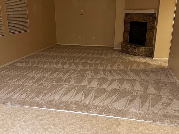 Family Rm with gas fireplace and brand new plush carpet