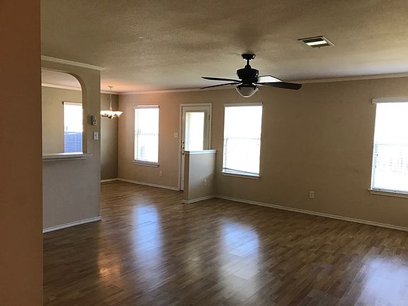 Living space open to kitchen and dining. Remote controlled fan and light.