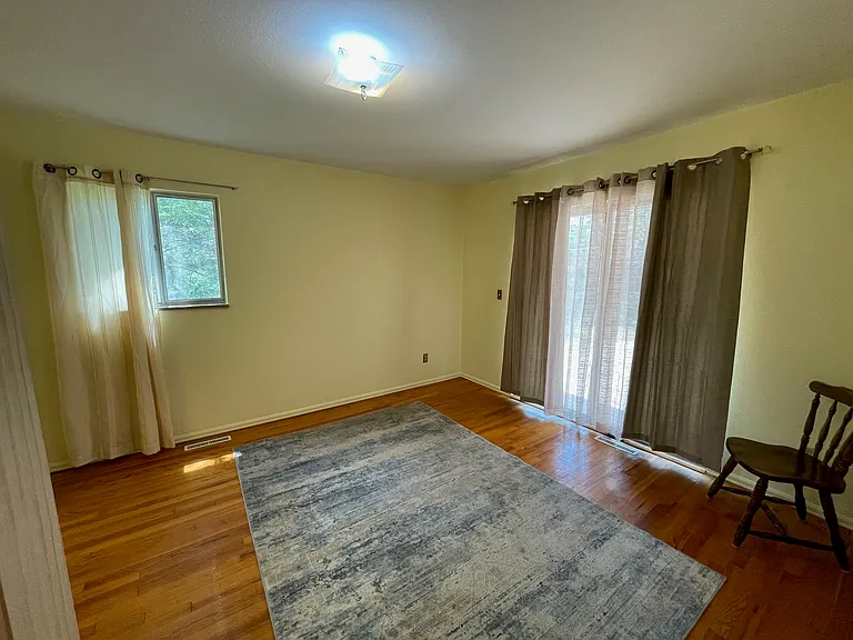 Third bedroom has sliding patio doors to backyard.