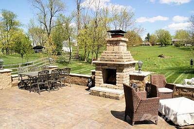 You'll enjoy outdoor living on the Tuscan patio with woodburning fireplace that overlooks a serene s