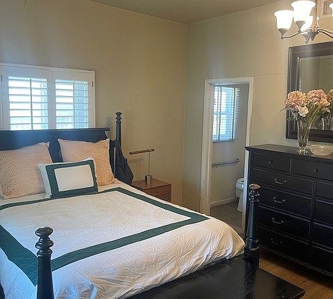 high ceiling bright primary suite