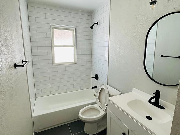 The bathroom is completely new with new tub, vanity, toilet, tile and sink.