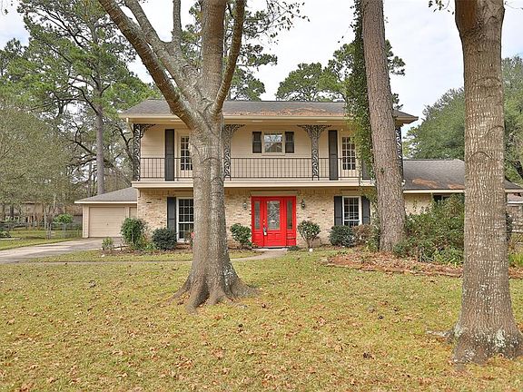 Front of your new home shows upstairs balcony accessed from two of the upstairs bedrooms. Two-car detached garage.