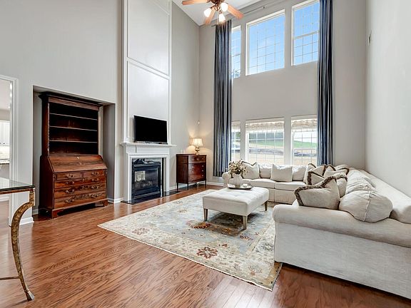 So much natural light pours into this 2-story Great Room! This living area is one of 3 common family living areas in this spacious residence!