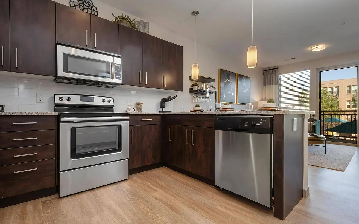 Granite Countertops and Sleek Appliances - Trifecta Belmar