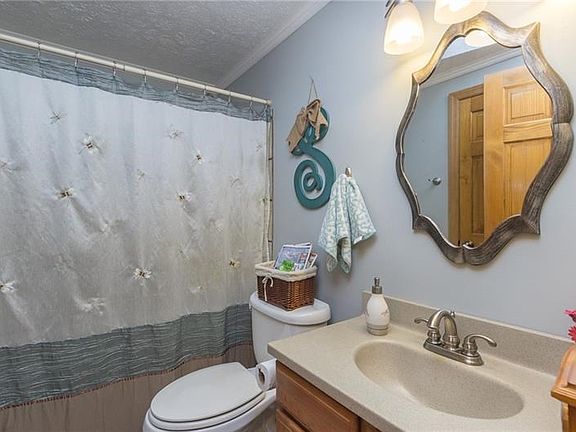 Updated First Floor Full Bath with jacuzzi tub.