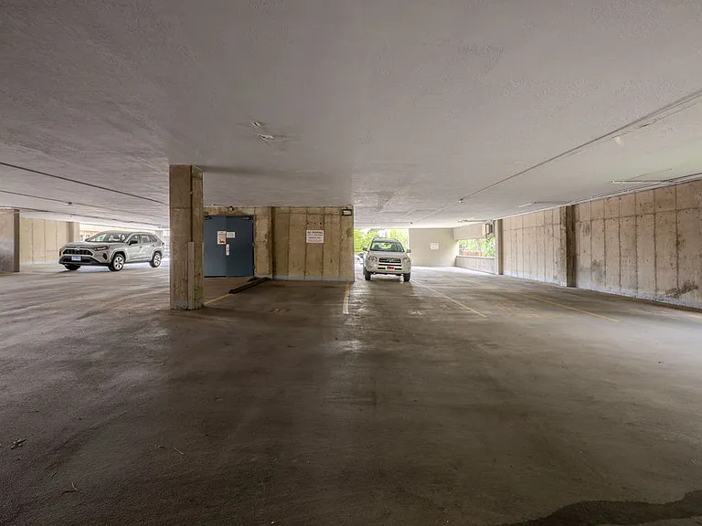 Covered parking garage space included