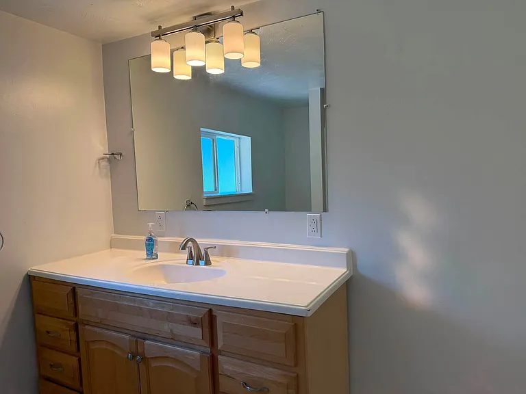 Large vanity amd mirror in bathroom