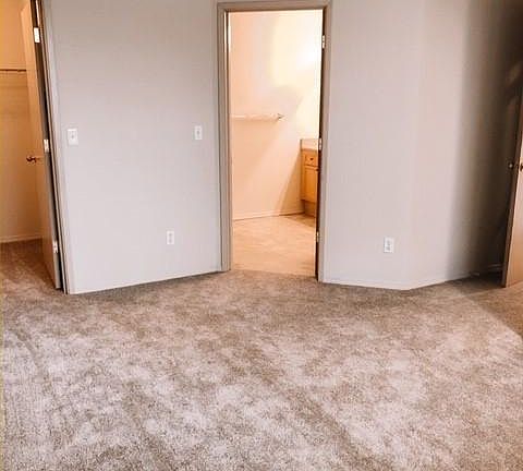 Master bedroom with door to walk in closet and master bathroom.