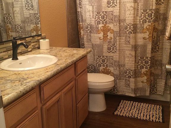 Upgraded bathrooms with contemperaryfaucets sinks and granit