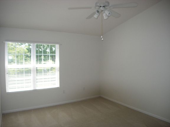 Peaceful sleeping in the master suite with vaulted ceiling.