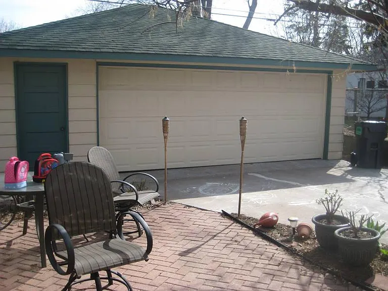 Back patio facing garage from kitchen