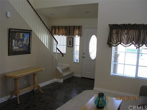 Interior View entry way featuring custom entry door and slate tile flooring.