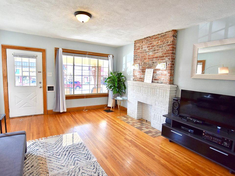 Home opens up to a spacious living room with natural, bright lighting from west and south facing windows.