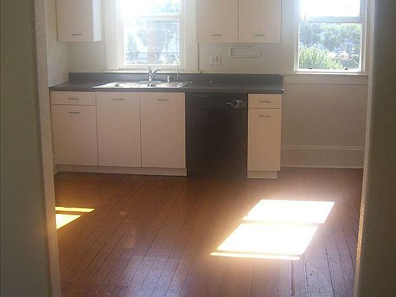 Full kitchen with dishwasher.