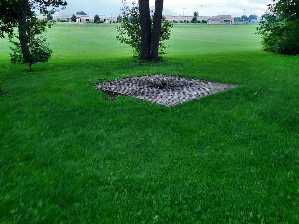 Fire pit area, school in back yard.