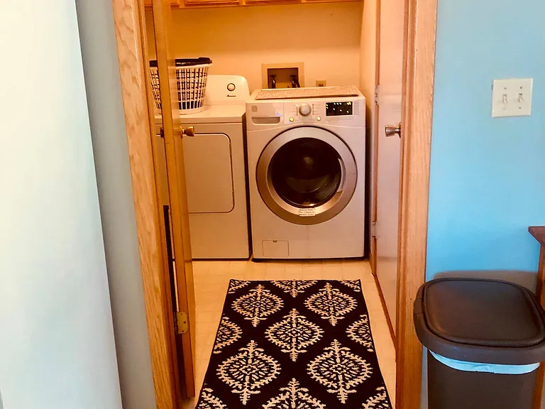 Washer and dryer of the kitchen with shelf space for extras.