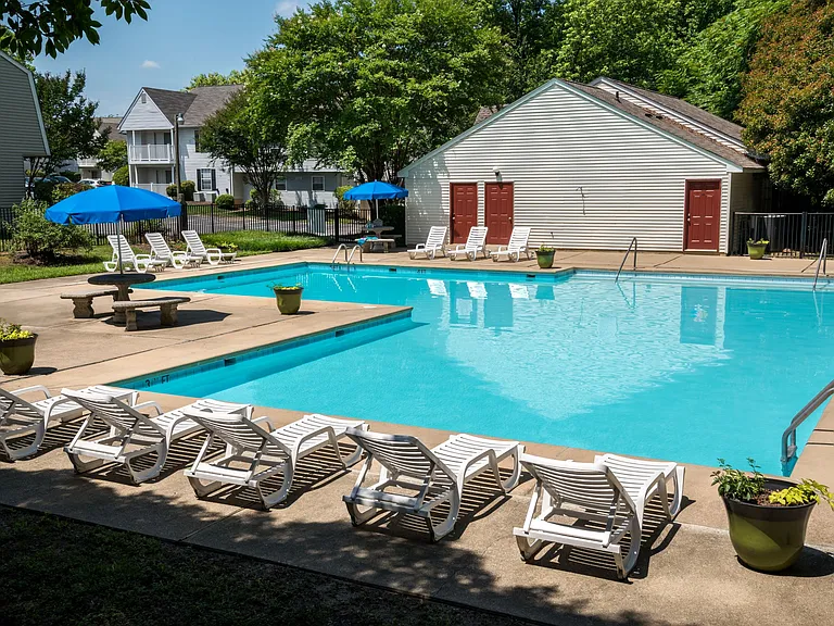 Resort style swimming pool with lounge chairs