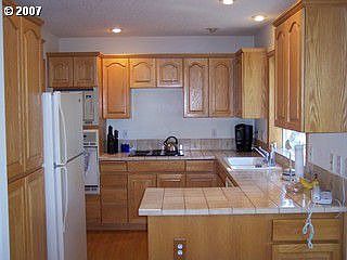 Big open kitchen with tile counters