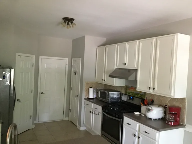 Kitchen with stove, roaster oven, rice cooker, coffee maker