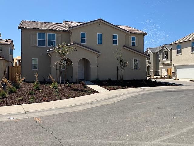 House front with ample guest parking.