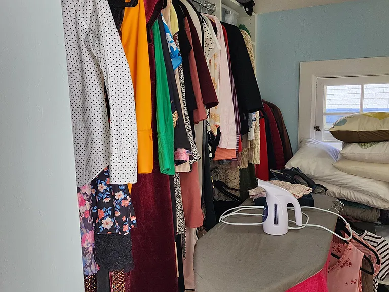 Huge walk in closet in master bedroom. Big enough for an ironing board and desk!