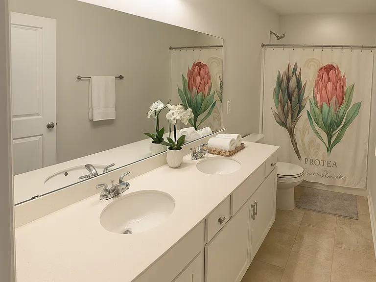 2nd Floor Bathroom with double vanity and shower/tub.