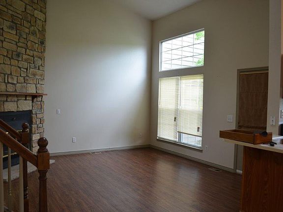 Family room in right off the kitchen and eating area, and includes a lots of natural light and hardwood laminate floors
