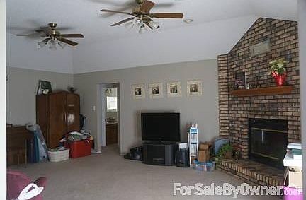 Living Room
						:
						French doors to the backyard off to the right of the fireplace, vaulted ceiling.