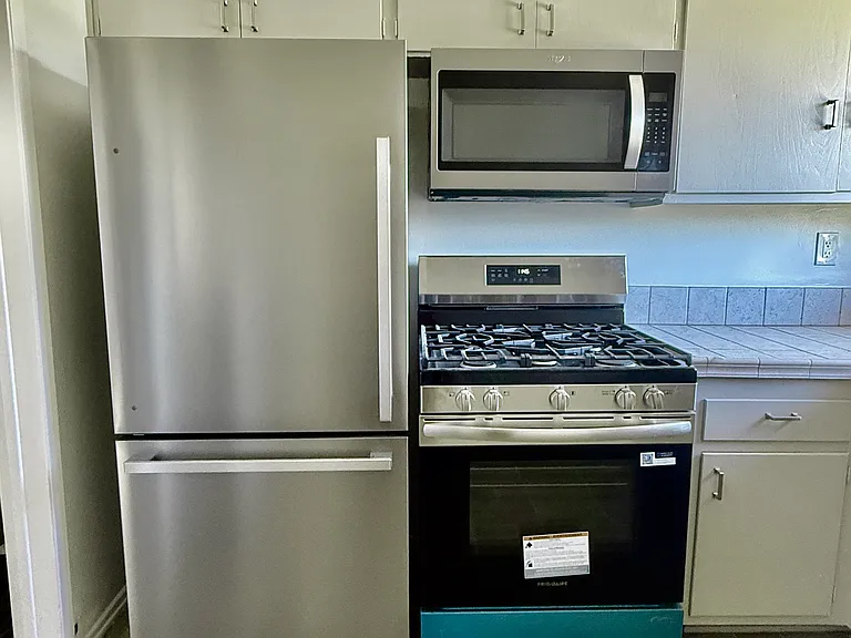 Brand new High end stainless steel appliances! Raised/ Coffered Ceiling in Kitchen.
