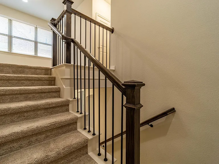 Rich wood and iron stair railing