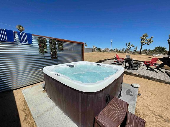 Jacuzzi is INCLUDED! With concrete steppers off Primary bedroom sliding door.