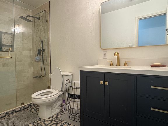 Upstairs remodeled common bathroom with walk-in shower