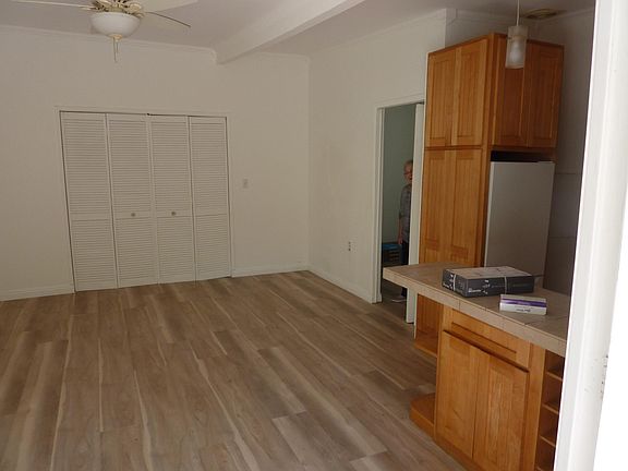 Living room with closet, bedroom to the right and open kitchen with bar counter!