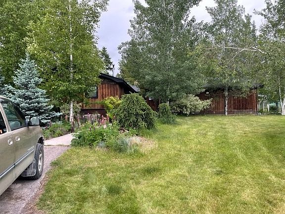 Parking and front door walkway - lots of trees and landscaping
