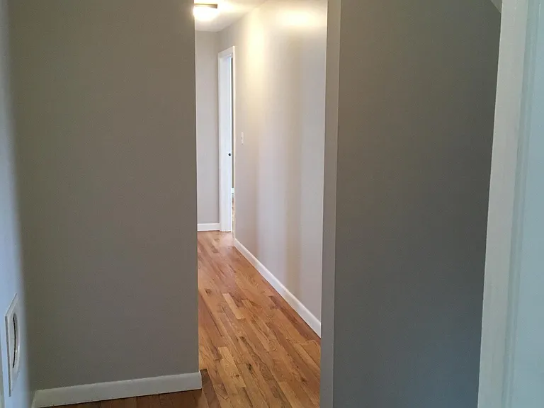 Upstairs hallway at top of staircase, exiting master bedroom