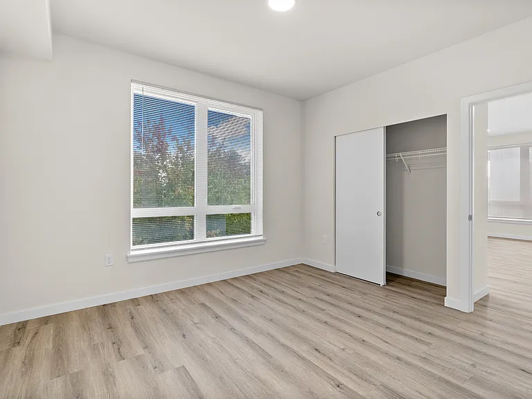 Bright bedroom with natural light and built-in closet. Bright bedroom with natural light and built-in closet.