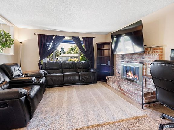 Newer carpet and fireplace!