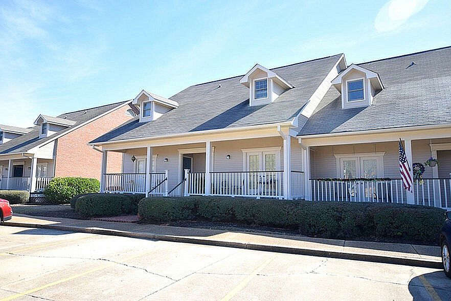 Experience the charm of suburban living with spacious porches and scenic surroundings.