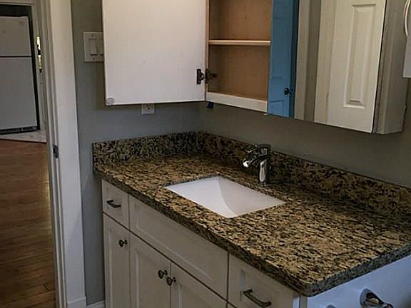 Full bath with tub/shower combo.