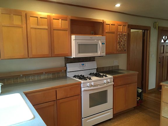 Kitchen, looking SE showing door to master bedroom and front door